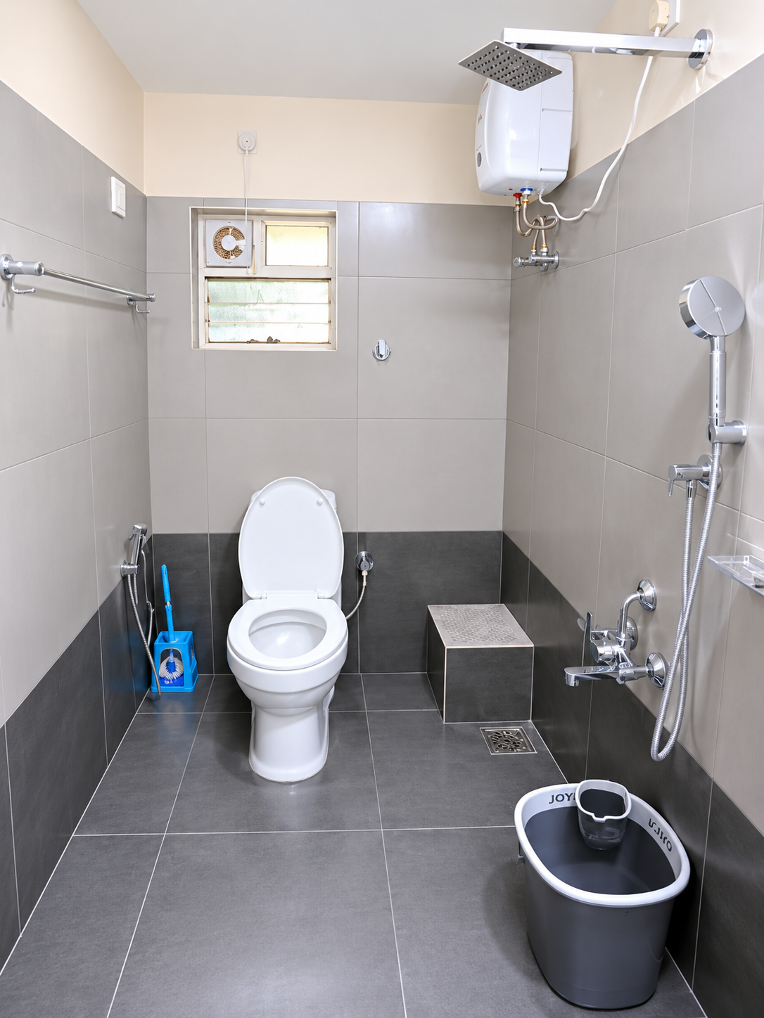 Clean modern restroom with geyser shower at Hima Havens Guruvayur Homestay